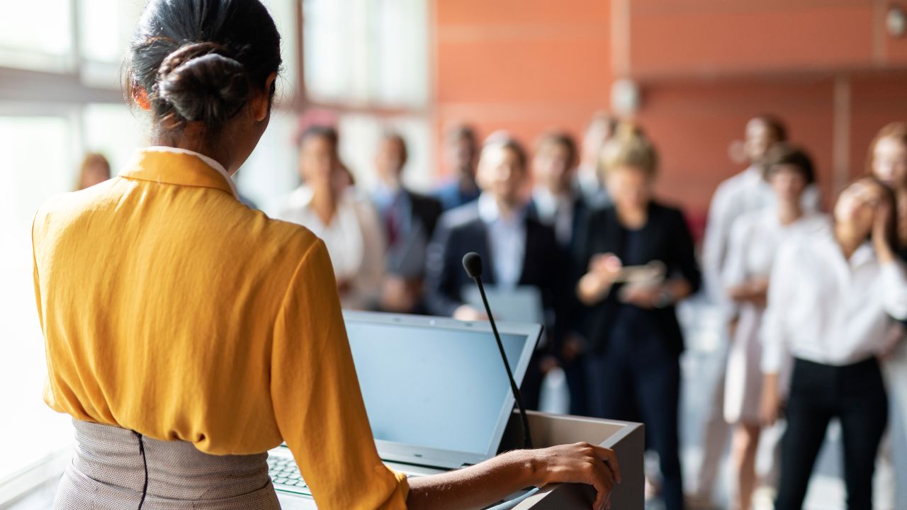 voice user speaking to a group of people after using the voice straw