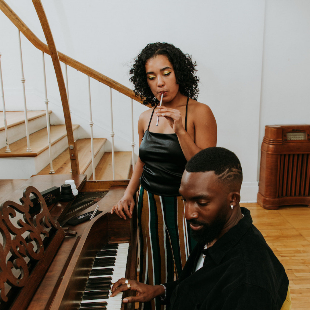 woman using voice straw to warm up and man playing piano. Voice Straw is the #1 tool for professional singers, actors, speakers and daily voice users. It's backed by science and utilizes straw phonation to make singing and speaking easier.